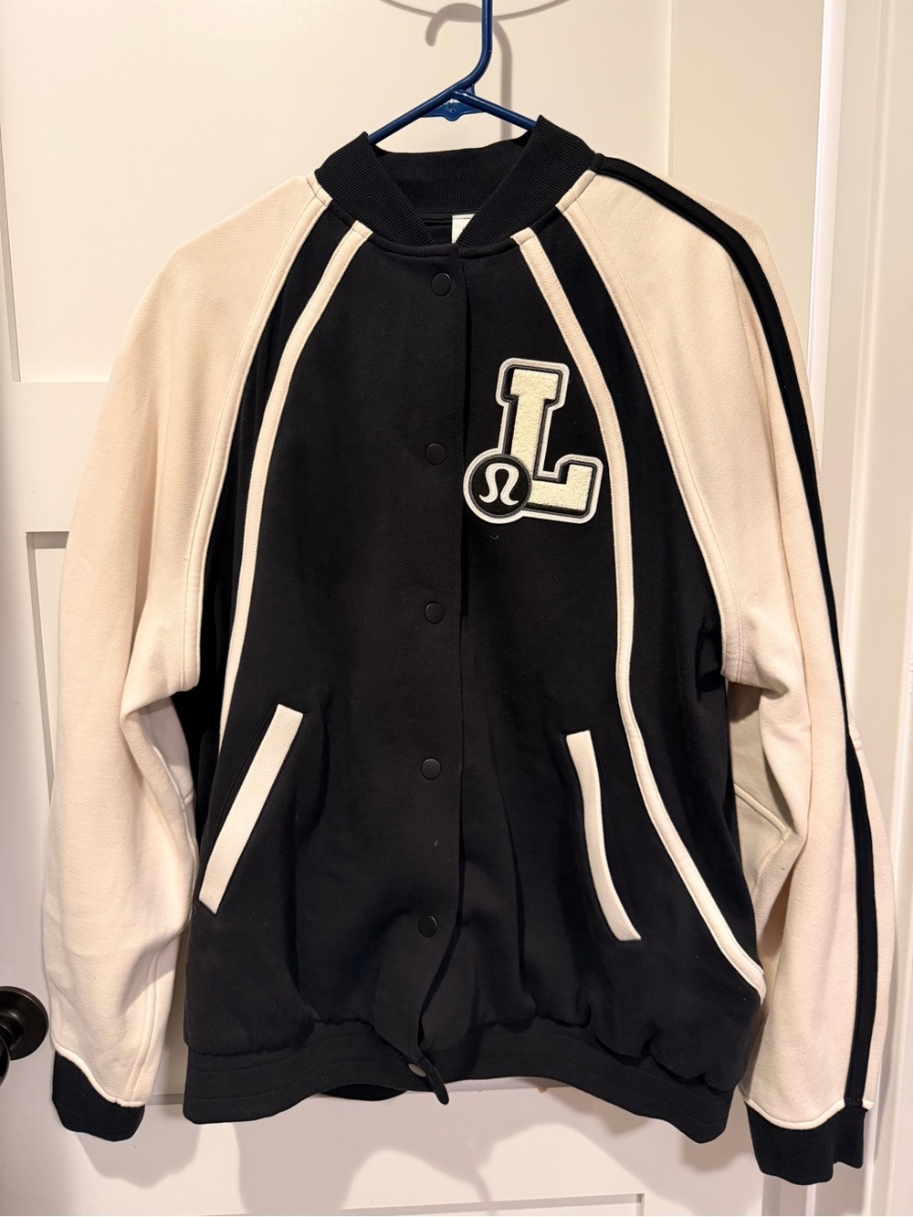 lululemon athletica Black and Cream Varsity Jacket with L Patch